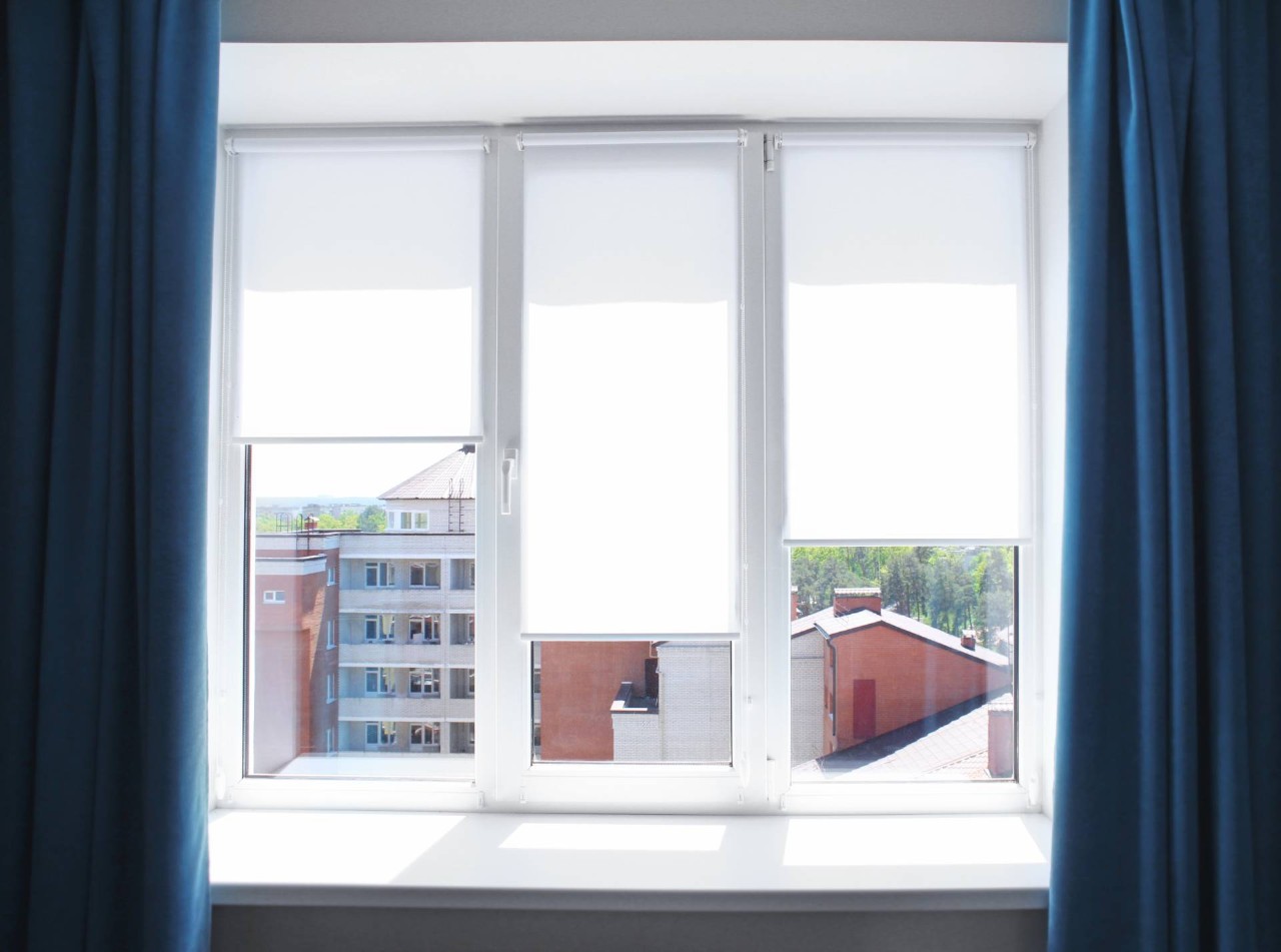 Roller blinds on windows overlooking an apartment complex near Sacramento, California (CA)