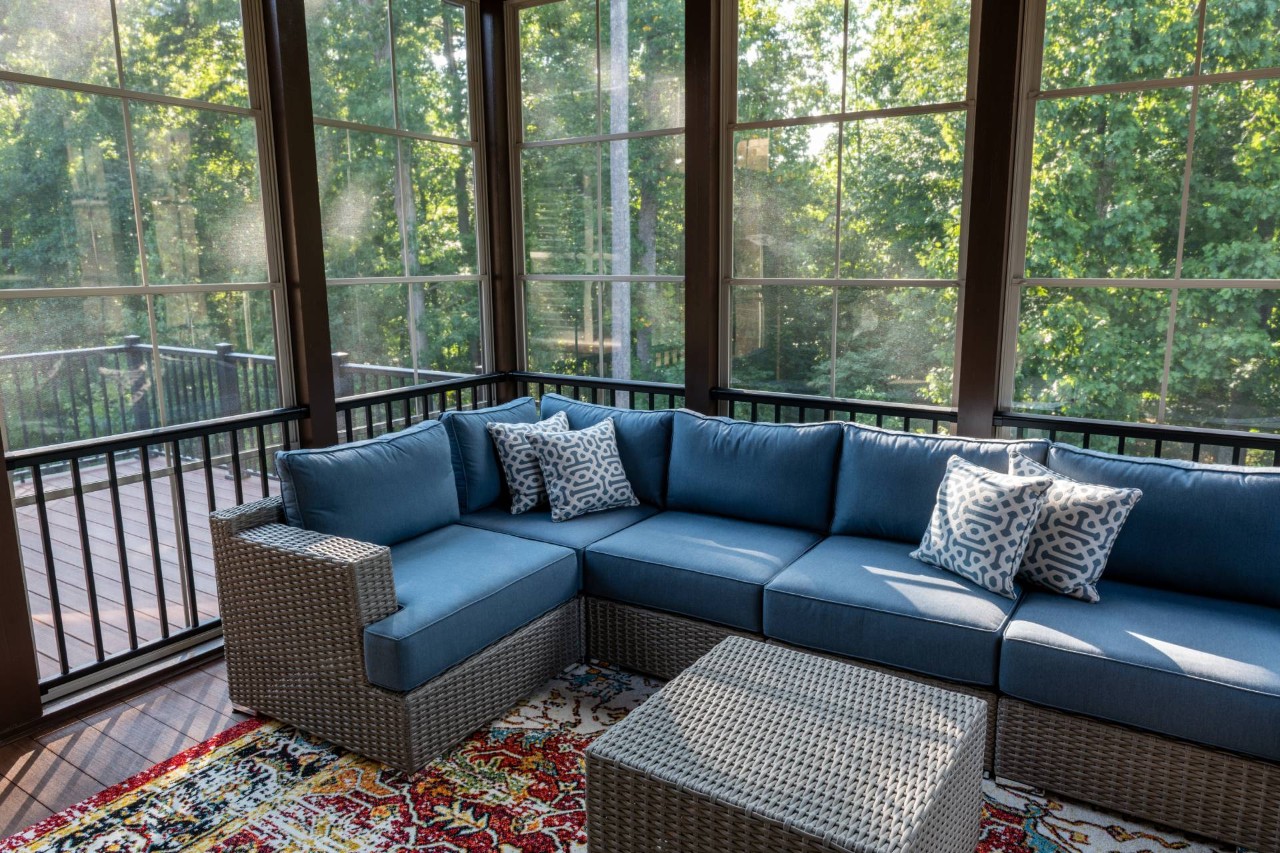 An enclosed patio with an L-shaped seating arrangement at Rico's Window Coverings & Films near Sacramento, CA